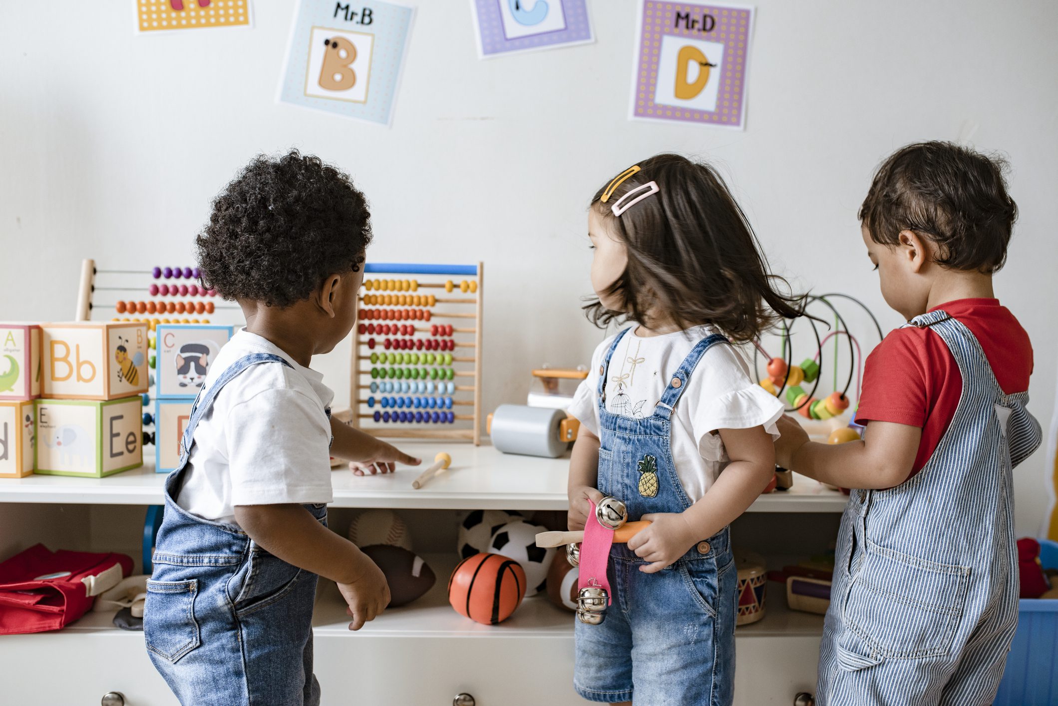 Preschool children playing with educational toys.