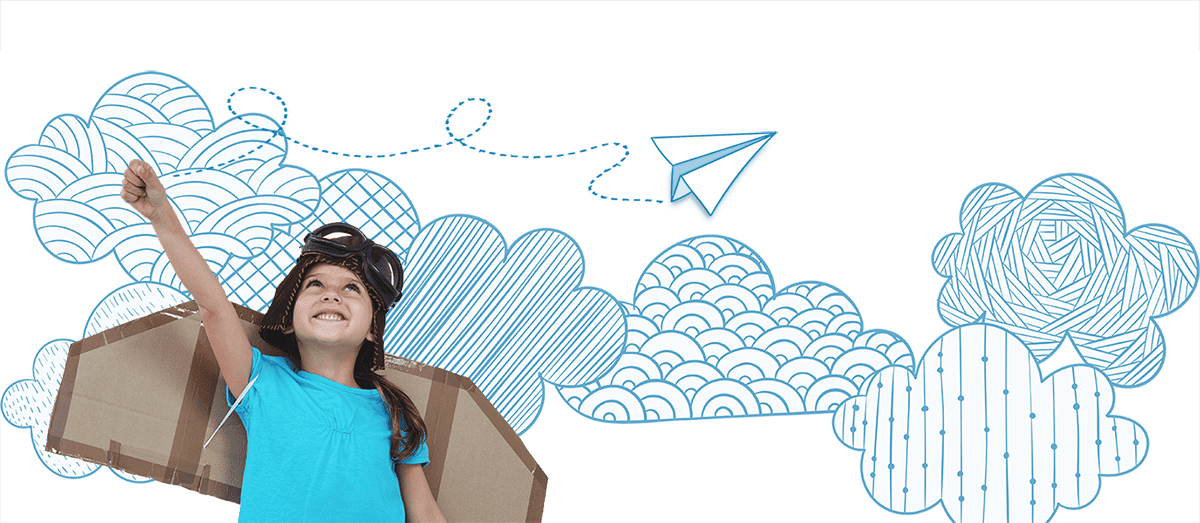 Young child pretending to fly airplane with cardboard wings on back.